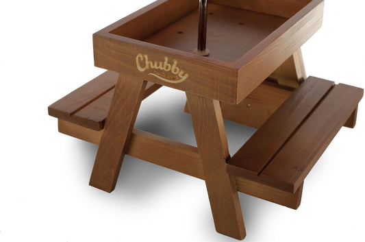 Close up of wooden squirrel picnic table feeder with sunken tabletop for nuts and seeds