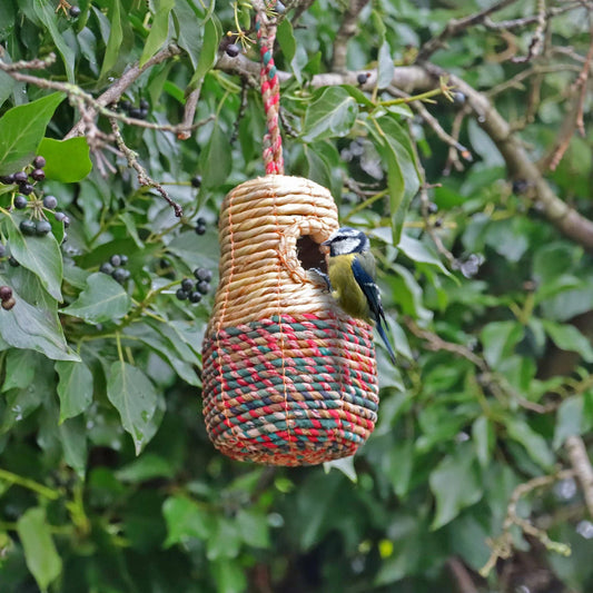 Close-up of recycled sari fabric on artisan bird nest box
