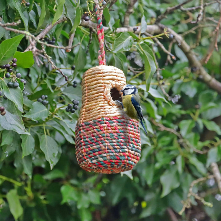 Close-up of recycled sari fabric on artisan bird nest box