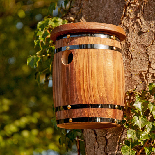 Front view of Wildlife World barrel bird nest box in natural wood finish